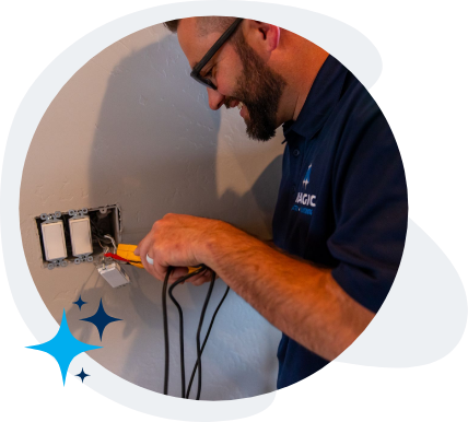 Technician checking the safety of the wires in an outlet