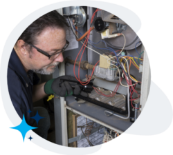 Technician repairing furnace